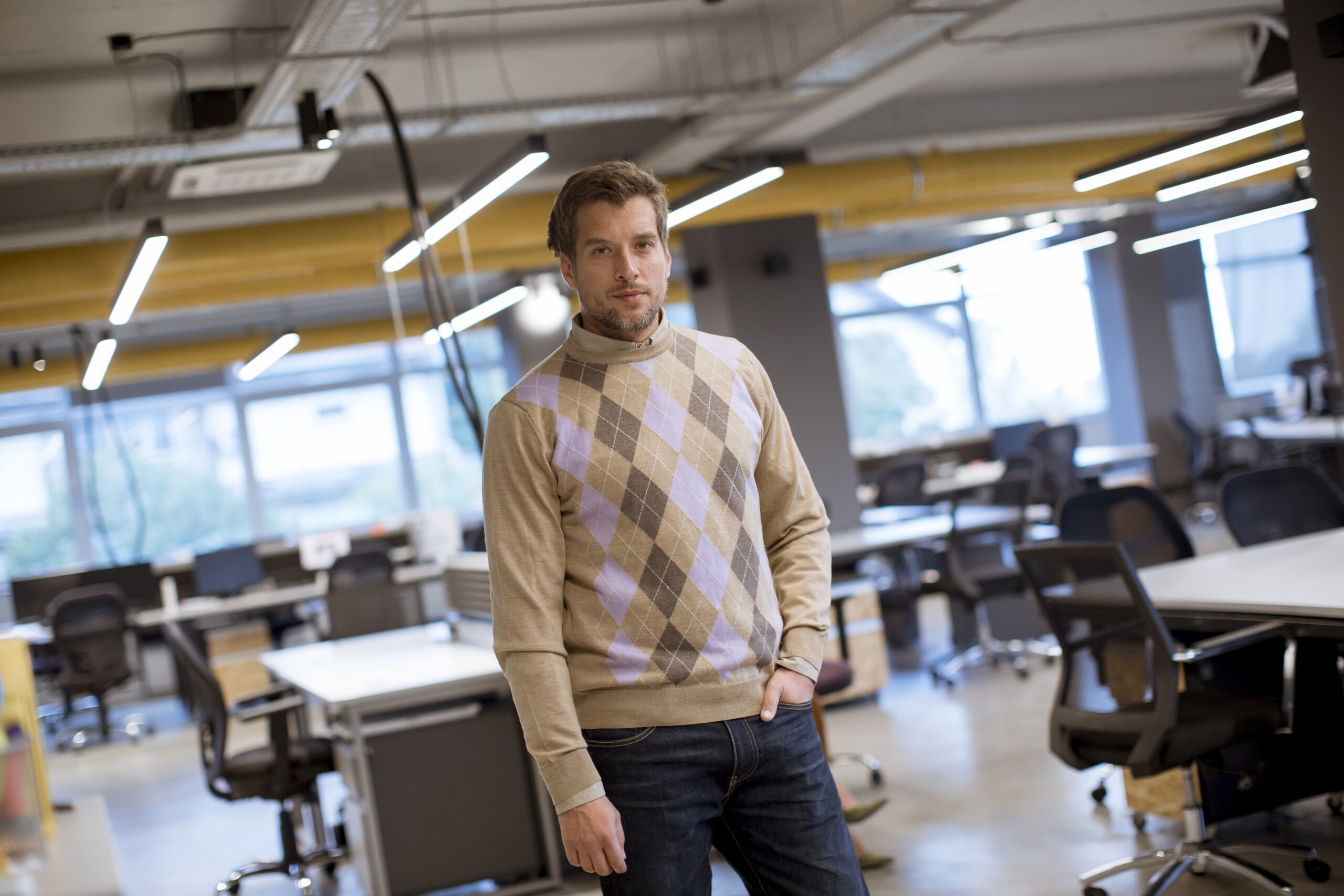 Portrait shot of handsome businessman wearing casual clothes whi